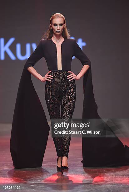 Model walks the runway at the Yousef Al-Jasmi show during Dubai Fashion Forward Spring/Summer 2016 at Madinat Jumeirah on October 23, 2015 in Dubai,...