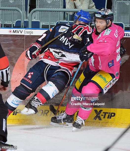 Andrew Joudrey of the Adler Mannheim and Micki DuPont of the Eisbaeren Berlin during the game between the Adler Mannheim and the Eisbaeren Berlin on...