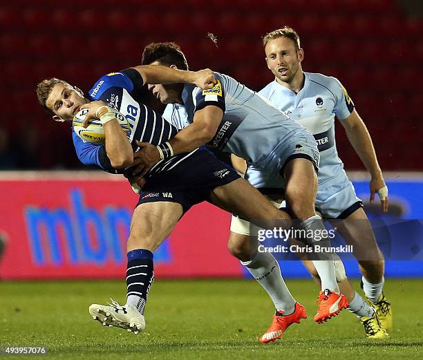 Will Addison of Sale Sharks is tackled by Wynand Olivier of Worcester Warriors during the Aviva Premiership match between Sale Sharks and Worcester...