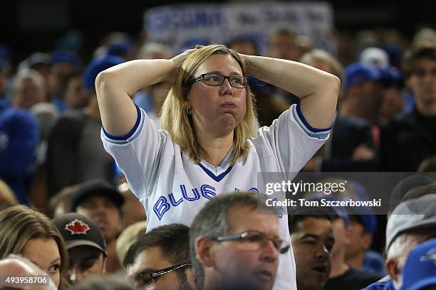 Toronto Blue Jays fan looks on anxiously against the Texas Rangers during game five of the American League Division Series at Rogers Centre on...