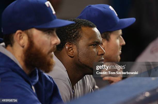 Hanser Alberto of the Texas Rangers and Sam Dyson look on from the dugout in the ninth inning against the Toronto Blue Jays during game five of the...