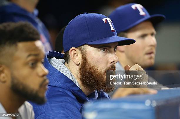 Sam Dyson of the Texas Rangers looks on from the dugout in the ninth inning against the Toronto Blue Jays during game five of the American League...