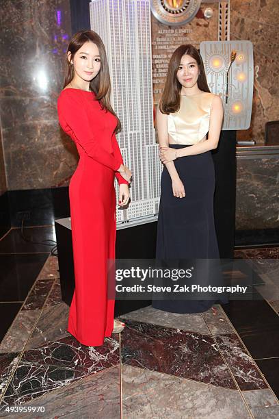 Kang Minkyung and Lee Haeri of K-Pop group "Davichi" visit The Empire State Building on October 23, 2015 in New York City.