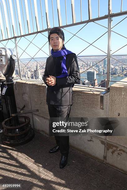 Pianist Lang Lang visits The Empire State Building on October 23, 2015 in New York City.