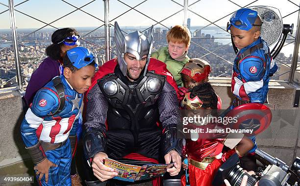 Robin Lopez and children from the Garden of Dreams Foundation visit the Empire State Building on October 23, 2015 in New York City.