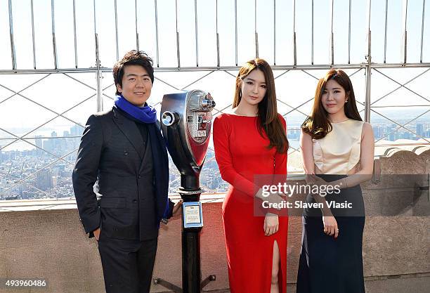 Pianist Lang Lang, Kang Minkyung and Lee Haeri of pop duo Davichi visit The Empire State Building on October 23, 2015 in New York City.