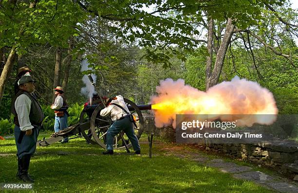 Civil War reenactors from Centre County fire a 10-pound Parrott rifled Cannon while serving as a Confederate Hampton's Legion Artillery unit....