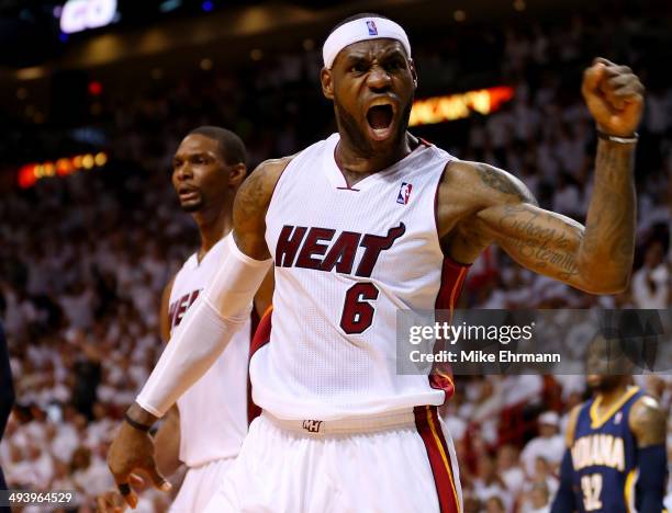 LeBron James of the Miami Heat reacts after a basket against the Indiana Pacers during Game Four of the Eastern Conference Finals of the 2014 NBA...