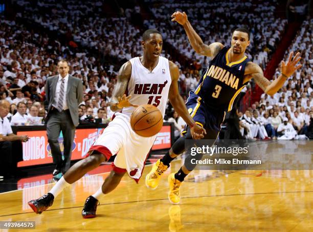 Mario Chalmers of the Miami Heat drives to the basket as George Hill of the Indiana Pacers defends during Game Four of the Eastern Conference Finals...