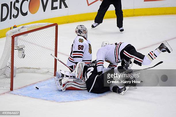Marian Gaborik of the Los Angeles Kings scores a first period goal past goaltender Corey Crawford of the Chicago Blackhawks in Game Four of the...