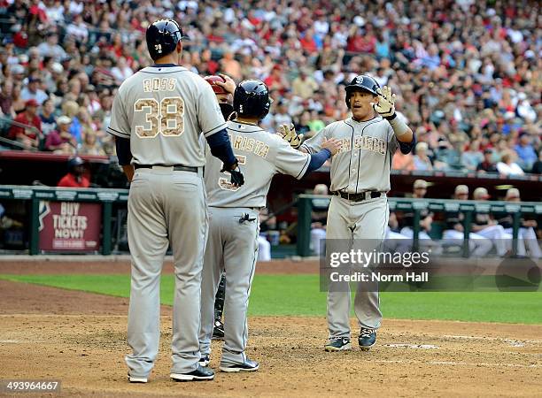 Everth Cabrera and teammates Alexi Amarista and Tyson Ross of the San Diego Padres celebrate a three run home run in the fifth inning against the...