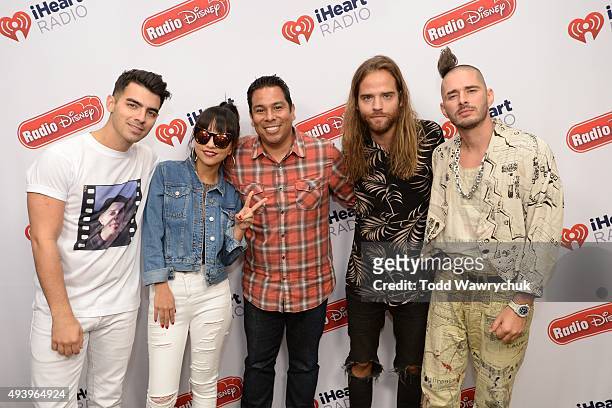 Frontman Joe Jonas and his new band, Republic Records' DNCE visited Radio Disney Studios to talk about their single "Cake By The Ocean."