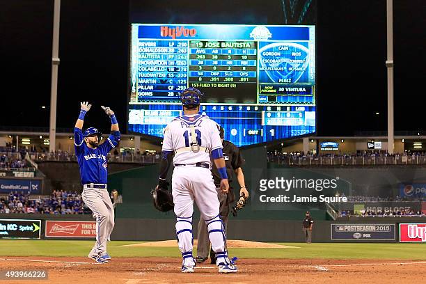 Jose Bautista of the Toronto Blue Jays rounds the bases after he hits a solo home run in the fourth inning against the Kansas City Royals in game six...