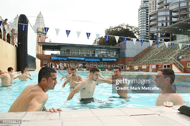 Tim Cahill and Tommy Oar stretch during a Australian Socceroos recovery session at North Sydney Pool on May 27, 2014 in Sydney, Australia.