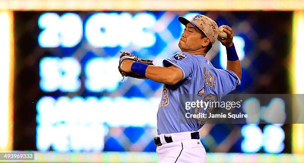 Norichika Aoki of the Kansas City Royals throws toward home after fielding the ball during the 8th inning of the game against the Houston Astros at...