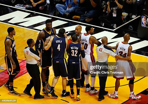 Players get involved after the whistle during Game Four of the Eastern Conference Finals of the 2014 NBA Playoffs between the Miami Heat and the...
