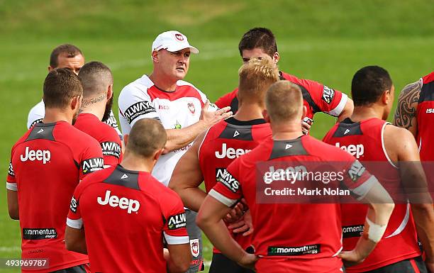 New Dragons coach Paul McGregor instructs his players during a St George Illawarra Dragons NRL training session at WIN Stadium on May 27, 2014 in...