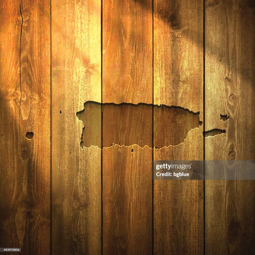 Puerto Map Rico on lit Wooden Background