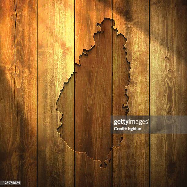saint lucia map on lit wooden background - french polynesia stock illustrations