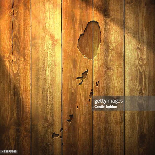 saint vincent and the grenadines map on lit wooden background - tobago cays grenadines stock illustrations