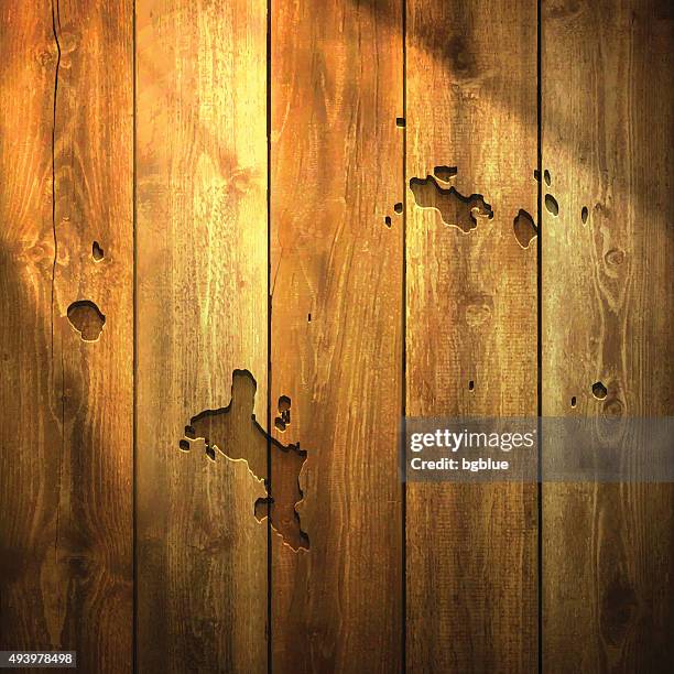 seychelles map on lit wooden background - dark timber stock illustrations