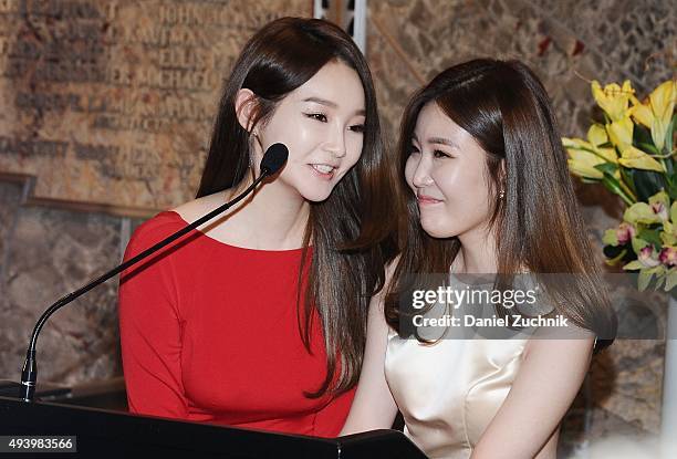 Kang Min-Kyung and Lee Hae-Ri of the Kpop group Davichi attend the lighting of The Empire State building on October 23, 2015 in New York City.