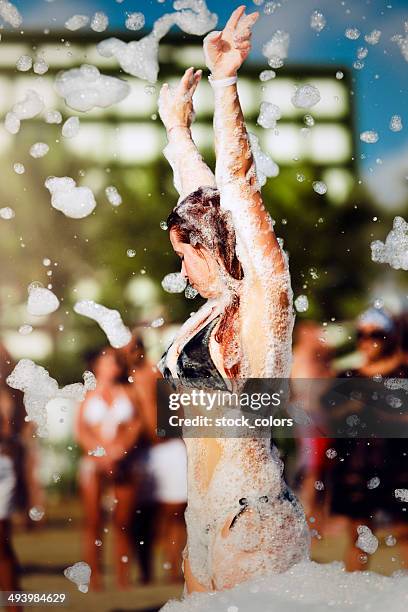 dancing woman - foam party stock pictures, royalty-free photos & images