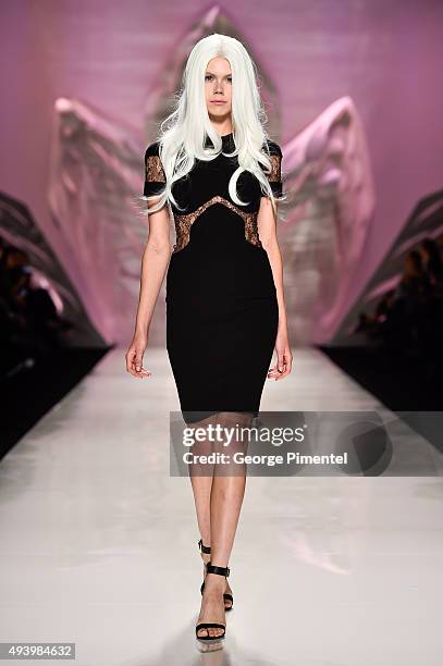 Model walks the runway wearing Mikael D spring 2016 collection during World MasterCard Fashion Week Spring 2016 at David Pecaut Square on October 23,...