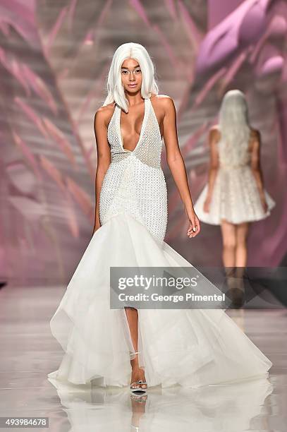 Model walks the runway wearing Mikael D spring 2016 collection during World MasterCard Fashion Week Spring 2016 at David Pecaut Square on October 23,...