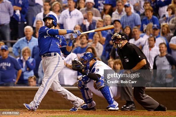 Jose Bautista of the Toronto Blue Jays hits a two-run home run in the eighth inning against the Kansas City Royals in game six of the 2015 MLB...