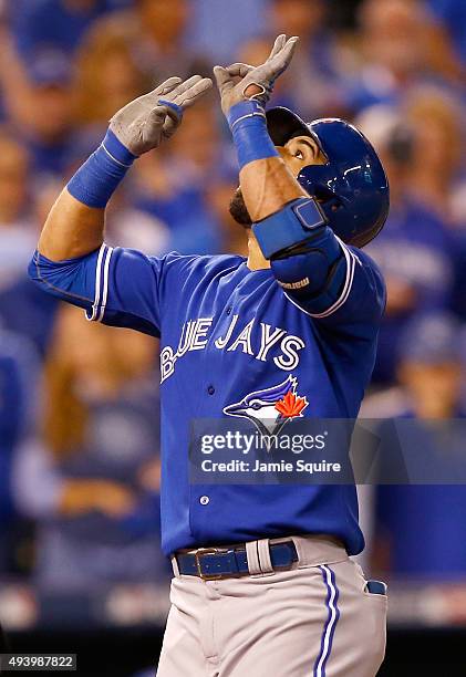 Jose Bautista of the Toronto Blue Jays celebrates after he hits a two-run home run in the eighth inning against the Kansas City Royals in game six of...