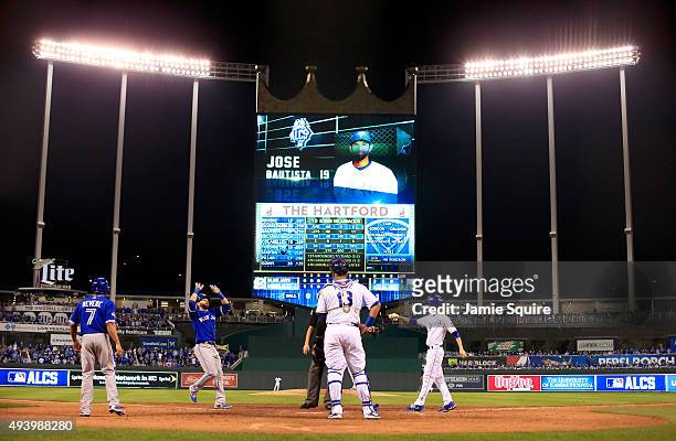 Jose Bautista of the Toronto Blue Jays celebrates after he hits a two-run home run in the eighth inning against the Kansas City Royals in game six of...