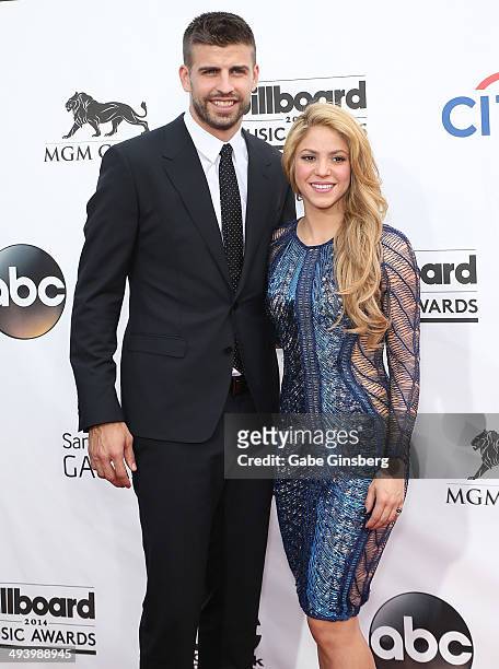 Professional Soccer player Gerard Pique and singer Shakira arrive at the 2014 Billboard Music Awards at the MGM Grand Garden Arena on May 18, 2014 in...