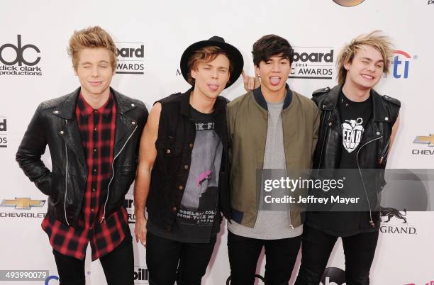 Recording artists Luke Hemmings, Ashton Irwin, Calum Hood and Michael Clifford of 5 Seconds of Summer arrive at the 2014 Billboard Music Awards at...