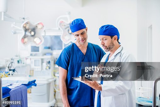 Two doctors comparing notes Two doctors comparing notes