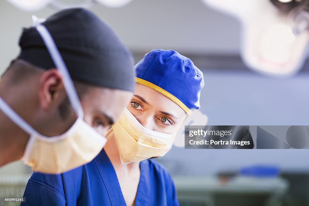 Surgeons working on a patient in an operating room