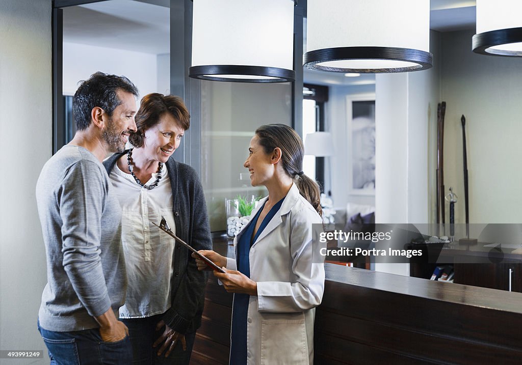 Female doctor and patients communicating.