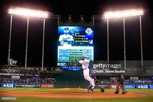 Lorenzo Cain of the Kansas City Royals celebrates after scoring in the eigthth inning against the Toronto Blue Jays in game six of the 2015 MLB...