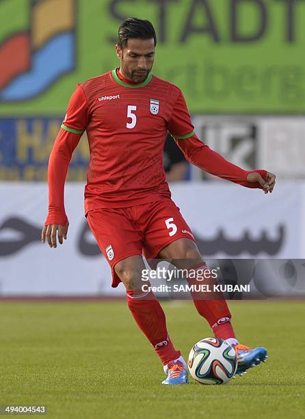Iran's defender Amir Hossein Sadeghi plays the ball during the friendly football match Iran vs Montenegro in preparation for the FIFA World Cup 2014...