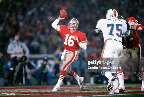 Joe Montana of the San Francisco 49ers throws a pass against the Miami Dolphins during Super Bowl XIX on January 20, 1985 at Stanford Stadium in Palo...