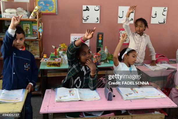 Young sub-Saharan migrant attends an Arabic class on May 12, 2014 at a school in the Moroccan capital Rabat. The Moroccan government has put into...