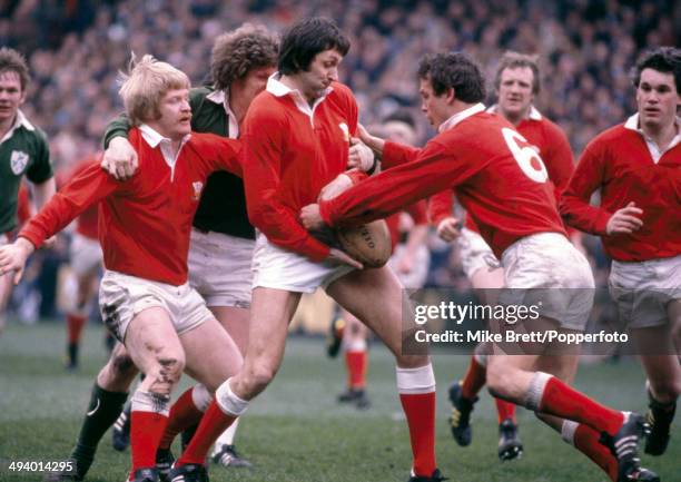 Steve Fenwick, Roger Blyth and Stuart Lane of Wales block Fergus Slattery during the Five Nations International match between Ireland and Wales at...