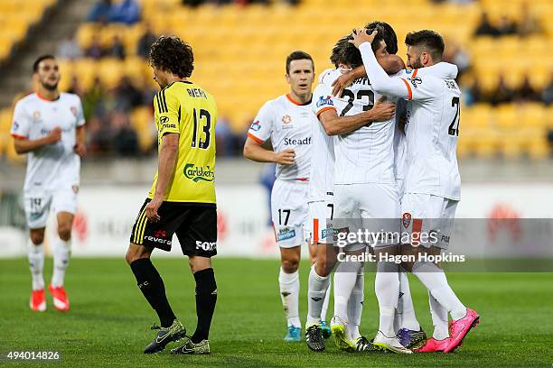 Dimitri Petratos of the Roar is congratulated on his goal by Brandon Borrello of the Roar during the round three A-League match between the...