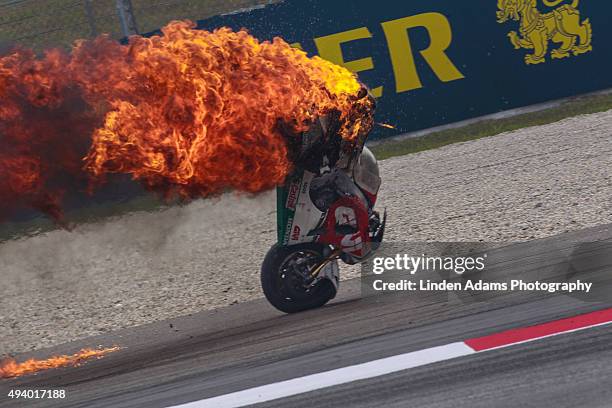 The LCR Honda bike of Australian rider Jack Miller bursts into flames at Sepang Circuit on October 24, 2015 in Kuala Lumpur, Malaysia.