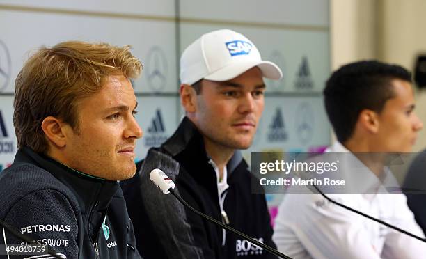 Formula 1 driver Nico Rosberg of Germany, golf professional Martin Kaymer of Germany and DTM driver Pascal Wehrlein of Germany talk to the media...