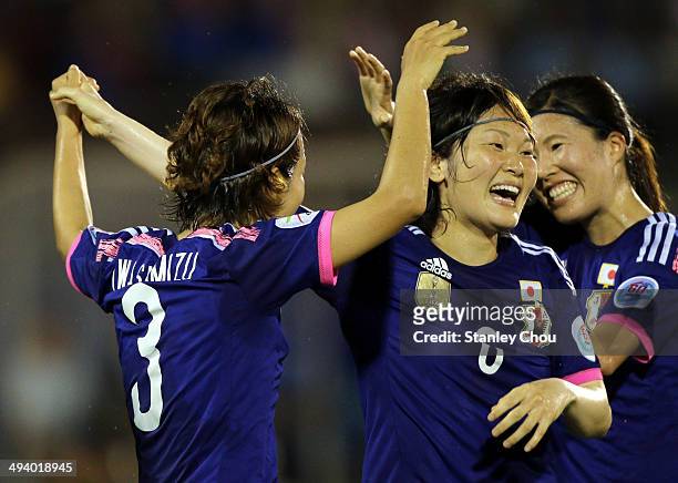 Azusa Iwashimizu#3 of Japan celebrates with Sagaguchi Mizuho#6 after scoring the 1st goal against Australia during the AFC Women's Asian Cup Final...