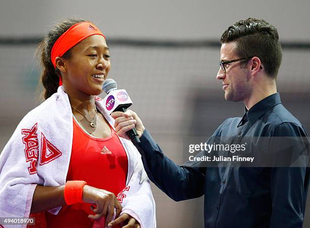 Naomi Osaka of Japan speaks to Nick McCarvel after winning her round robin match against Zhu Lin of China during the WTA Rising Stars Invitational at...