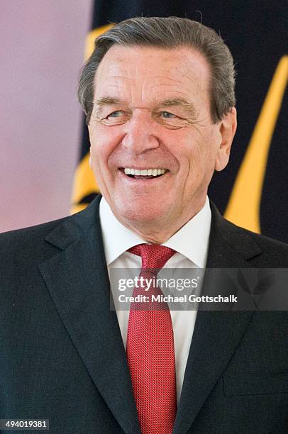 Former German chancellor Gerhard Schroeder arrives for a reception in Bellevue Castle on the occasion of Schroeders 70th birthday on May 27, 2014 in...