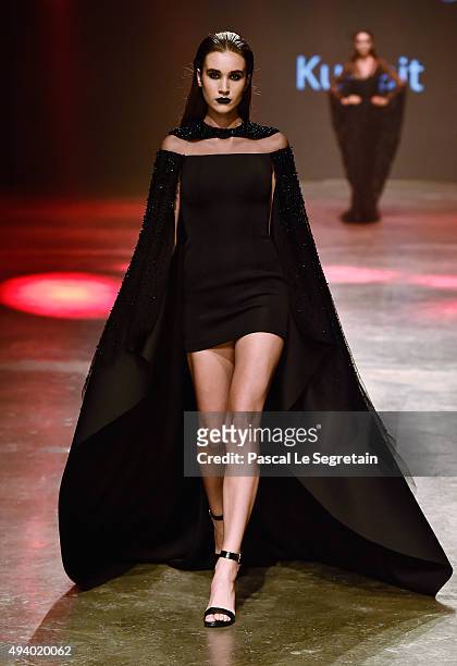 Model walks the runway at the Yousef Al-Jasmi show during Dubai Fashion Forward Spring/Summer 2016 at Madinat Jumeirah on October 23, 2015 in Dubai,...