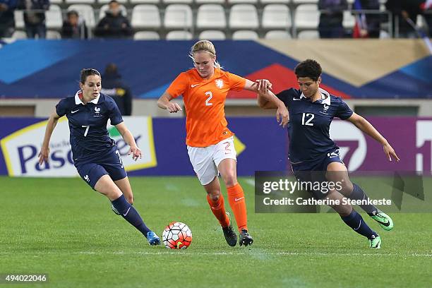 Desiree van Lunteren of Netherlands tries to control the ball against Aurelie Kaci and Valerie Gauvin of France during the international friendly...